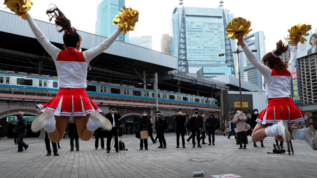 Japanese Cheerleaders Lift Spirits in Tokyo Ahead of Covid-19 lockdown