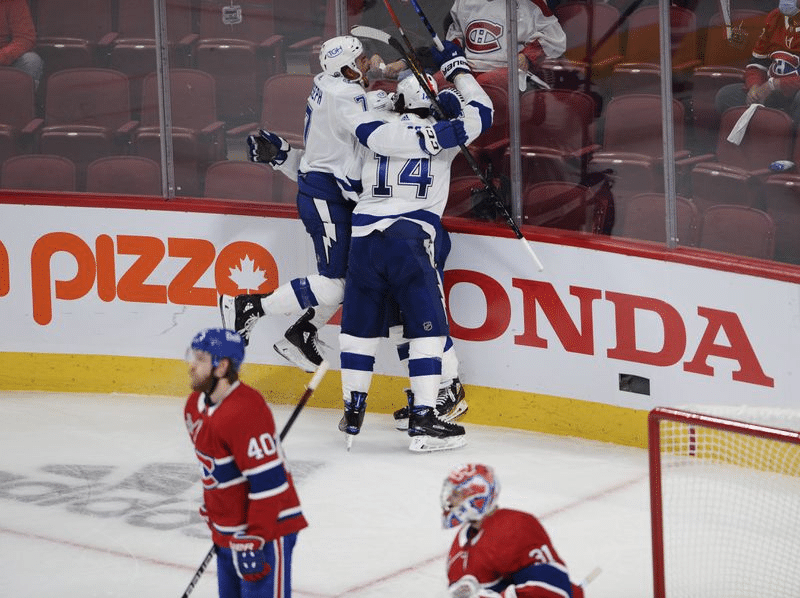 Tampa Bay Lightning players celebrate a goal against Montreal Canadiens goaltender Carey Price (31) during the third period of Game 3 of the NHL hockey Stanley Cup Final