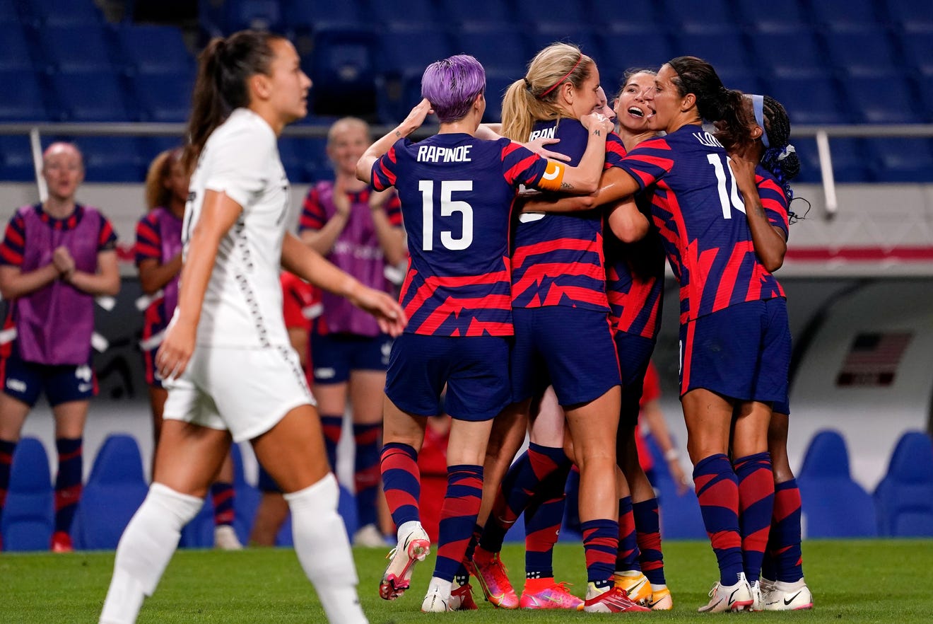 Team USA celebrates a goal by midfielder Rose Lavelle (16) during the first half against New Zealand in group G play during the Tokyo Olympics.