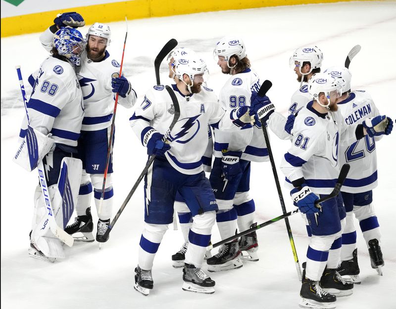 The Tampa Bay Lightning congratulate goaltender Andrei Vasilevskiy after a 6-3 win against the Montreal Canadiens in Game 3 of the Stanley Cup Final