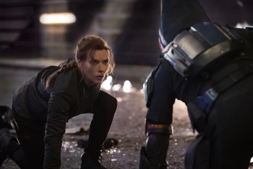 From left, Black Widow/Natasha Romanoff (Scarlett Johansson) faces off against Taskmaster in a scene from Marvel Studios’ “Black Widow.