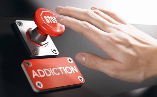 Psychology concept, Stop Addiction or Dependence Woman pressing a panic button with stop sign to overcome addiction or dependence problems. Psychology concept. drugs and addiction rehabilitation stock pictures, royalty-free photos & images