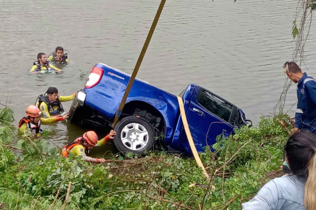 Woman killed after pickup plunges into pond