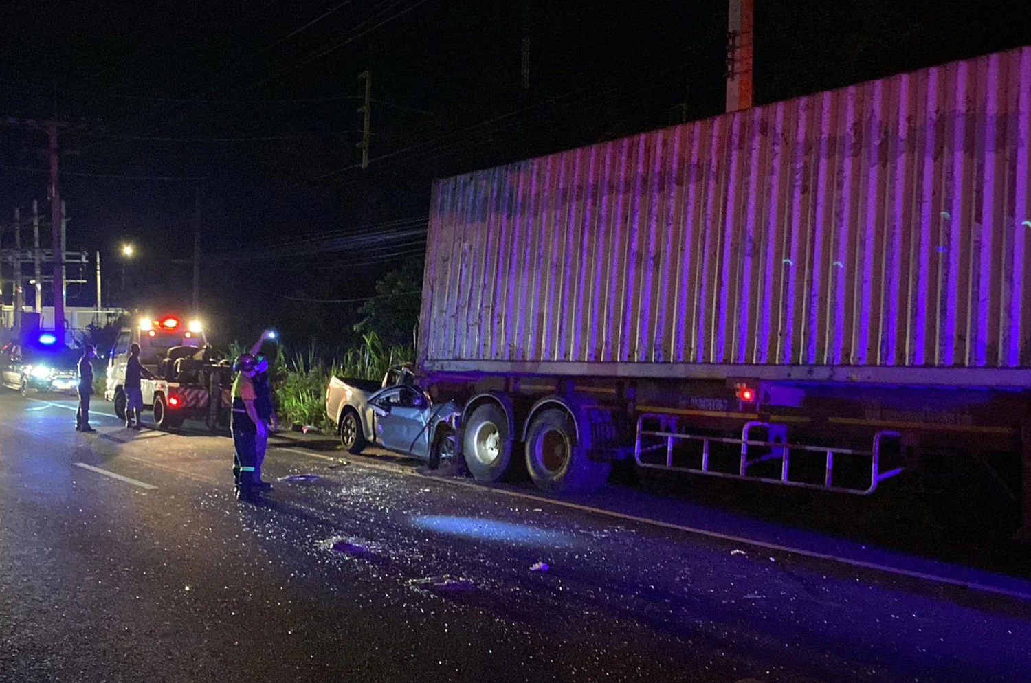 Isuzu Pickup Crashes into Parked Container Truck