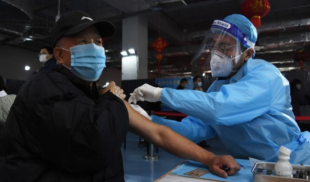 China Urges Elderly Vaccination Amid Reopening Pressure