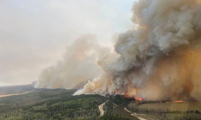 Tens of Thousands Flee Wildfires in Alberta, Canada