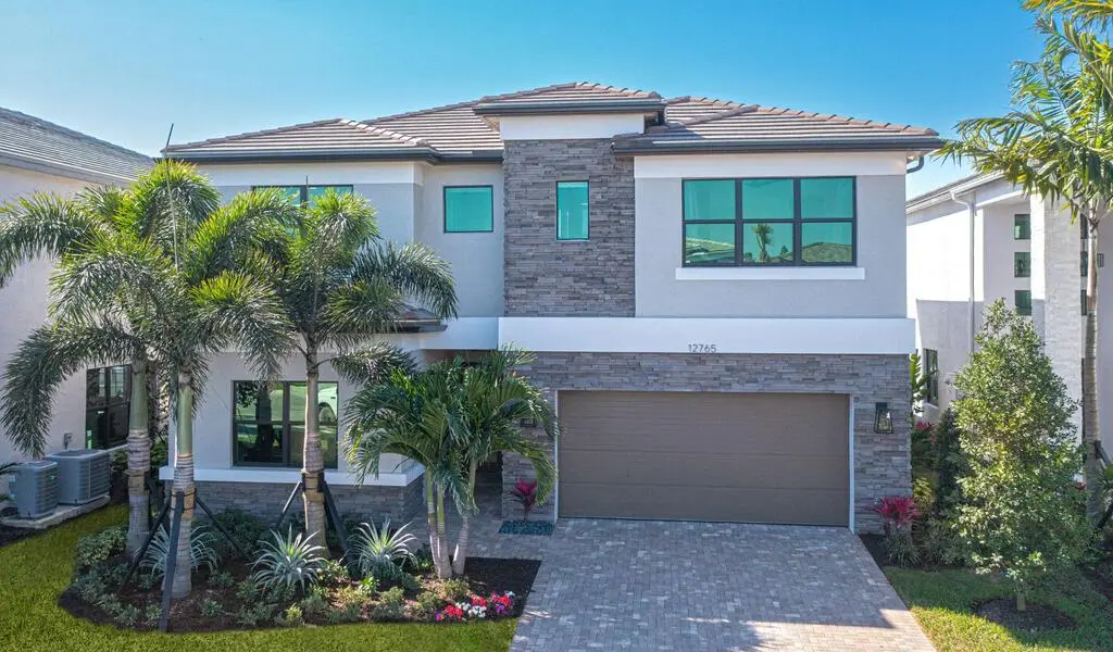A picture of the home exterior for the GL Homes Denali plan at RiverCreek, located in Estero, Florida.