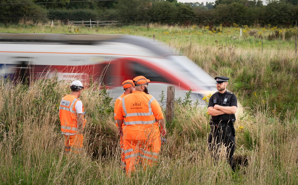 Police Officer Struck by Train While Helping Man on Tracks Dies