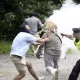 Swedish Police Detain Woman for Using Fire Extinguisher Against Quran-Burning Protester