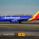 Southwest Airlines Passenger Hospitalized For Opening Emergency Exit And Climbing Onto Wing.