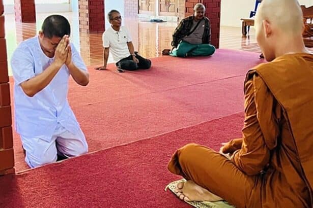 Former Monk Phra Khru Siriwiriyathada gives a wai to monks at Charoen Dhamma Forest Monastery
