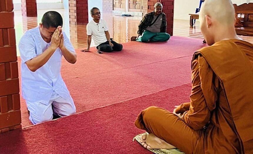 Former Monk Phra Khru Siriwiriyathada gives a wai to monks at Charoen Dhamma Forest Monastery