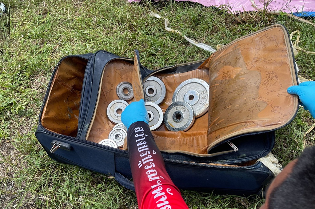 woman's body was found crammed inside a suitcase