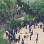 Thailand's Riot Police Fire Tear Gas and Rubber Bullets at Cambodian Protesters 