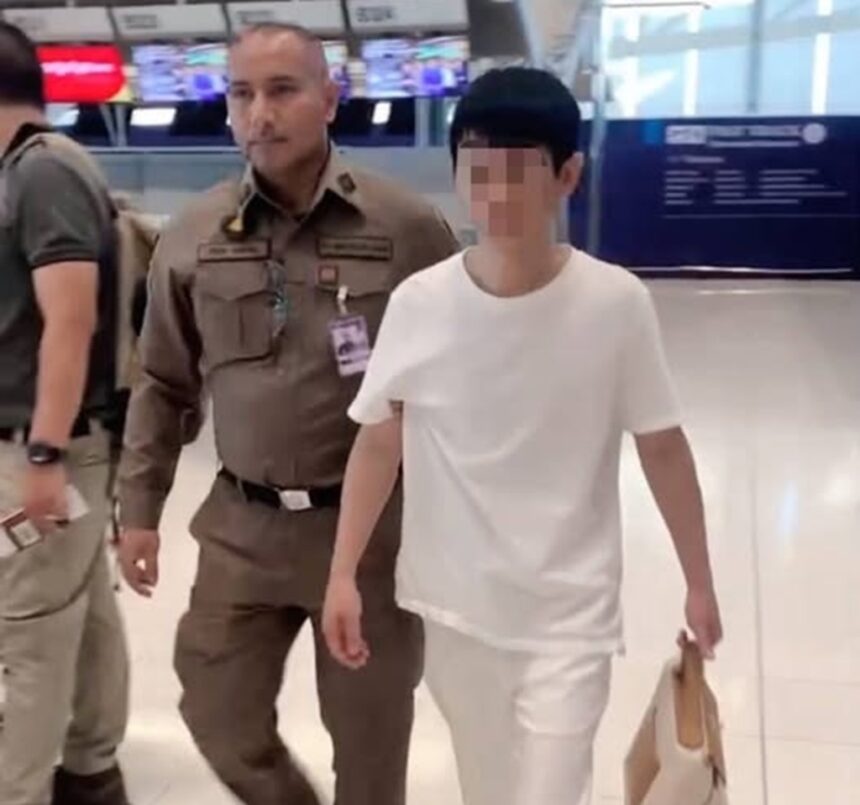 A Chinese fugitive wanted on an Interpol Red Notice is seen along with some of the evidence seized by immigration police officers at Suvarnabhumi airport