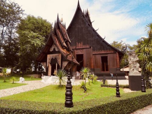 Traditional dark wooden building at Black House museum in Chiang Rai