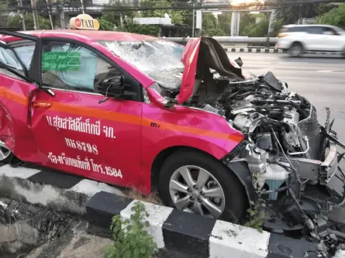 Severely damaged taxi in accident