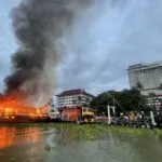 Fire Destroys Tourist Boats Near Luxury Bangkok Hotel by Chao Phraya River
